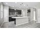 Modern kitchen with dark cabinetry, island, and stainless steel appliances at 3207 Stratton Cir, Kissimmee, FL 34744
