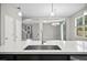Modern kitchen sink and faucet with view of dining and living areas at 3207 Stratton Cir, Kissimmee, FL 34744