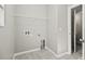 Laundry room with built-in shelving and tile floor at 3207 Stratton Cir, Kissimmee, FL 34744