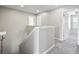 Upstairs hall with carpet and access to bedrooms at 3207 Stratton Cir, Kissimmee, FL 34744