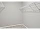 Spacious walk-in closet with wire shelving and hanging rods at 3207 Stratton Cir, Kissimmee, FL 34744
