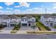 Two-story house in a neighborhood with a paved driveway and landscaped yard at 7457 Marker Ave, Kissimmee, FL 34747