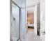 Bathroom with shower, toilet, and view into bedroom at 7457 Marker Ave, Kissimmee, FL 34747