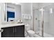 Clean bathroom with a shower and a vanity with dark brown cabinets at 7457 Marker Ave, Kissimmee, FL 34747