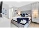Spacious bedroom with plush bed and large window at 7457 Marker Ave, Kissimmee, FL 34747