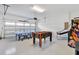 Game room with ping pong, foosball, and arcade game at 7457 Marker Ave, Kissimmee, FL 34747