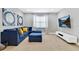Comfortable living room with sectional sofa and large TV at 7457 Marker Ave, Kissimmee, FL 34747