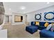 Spacious living room with sectional sofa and game decor at 7457 Marker Ave, Kissimmee, FL 34747