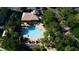 Community pool and surrounding landscape with palm trees at 7500 Toscana Blvd # 341, Orlando, FL 32819