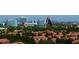 Community view with houses and a theme park in the background at 7500 Toscana Blvd # 341, Orlando, FL 32819