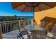 Balcony with lake view, table, and chairs for outdoor dining at 7500 Toscana Blvd # 341, Orlando, FL 32819