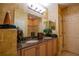 Bathroom with double vanity and granite countertops at 7500 Toscana Blvd # 341, Orlando, FL 32819