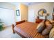 Spacious bedroom with double doors and a comfortable bed at 7500 Toscana Blvd # 341, Orlando, FL 32819