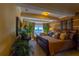 Main bedroom with a king-size bed, plush pillows, and lake view at 7500 Toscana Blvd # 341, Orlando, FL 32819