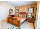 Well-lit bedroom with wood furniture and a comfortable bed at 7500 Toscana Blvd # 341, Orlando, FL 32819