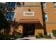 Condo building entrance with awning, showing address number 7500 at 7500 Toscana Blvd # 341, Orlando, FL 32819