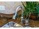 Close-up of a sleek, modern kitchen faucet at 7500 Toscana Blvd # 341, Orlando, FL 32819