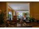Open kitchen with granite countertops and view of dining area at 7500 Toscana Blvd # 341, Orlando, FL 32819