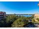 Panoramic lake view from a condo balcony, showcasing the surrounding area at 7500 Toscana Blvd # 341, Orlando, FL 32819