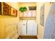 Convenient laundry room with washer, dryer, and cabinets at 7500 Toscana Blvd # 341, Orlando, FL 32819