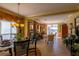 Open living and dining area with access to balcony and lake views at 7500 Toscana Blvd # 341, Orlando, FL 32819