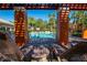 Inviting pool area with pergola, lounge chairs and palm trees at 7500 Toscana Blvd # 341, Orlando, FL 32819