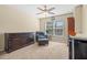 Relaxing bedroom with comfortable seating and large window at 8345 Bella Tierra Ct # 8345, Davenport, FL 33896