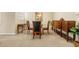 Formal dining room with round glass table and four chairs at 8345 Bella Tierra Ct # 8345, Davenport, FL 33896