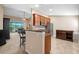 Modern kitchen with granite countertops and stainless steel appliances at 8345 Bella Tierra Ct # 8345, Davenport, FL 33896