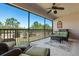 Screened lanai with seating area and tranquil views at 8345 Bella Tierra Ct # 8345, Davenport, FL 33896