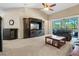 Living room with large TV, balcony access, and ample seating at 8345 Bella Tierra Ct # 8345, Davenport, FL 33896