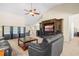 Open living space with built-in entertainment center and comfortable seating at 8345 Bella Tierra Ct # 8345, Davenport, FL 33896