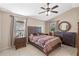 Spacious bedroom with ceiling fan and large window at 8348 Fort Clinch Ave, Orlando, FL 32822