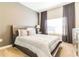 Bright bedroom with a large window, neutral tones, and a comfortable bed at 8943 Cabot Cliffs Dr, Davenport, FL 33896