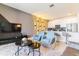 Open living area with comfortable seating and a large TV at 8943 Cabot Cliffs Dr, Davenport, FL 33896