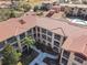Complex with red tile roofs and multiple pools at 904 Charo Pkwy # 525, Davenport, FL 33897