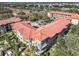 Complex features multiple buildings, pool, and parking at 904 Charo Pkwy # 525, Davenport, FL 33897
