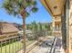 Balcony overlooks community pool and lush landscaping at 904 Charo Pkwy # 525, Davenport, FL 33897