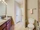 Clean bathroom with double vanity and toilet at 904 Charo Pkwy # 525, Davenport, FL 33897