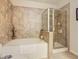 Relaxing bathroom with soaking tub and separate walk-in shower at 904 Charo Pkwy # 525, Davenport, FL 33897