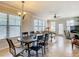 Bright dining area with tile flooring, large windows, and a six-chair table at 904 Charo Pkwy # 525, Davenport, FL 33897