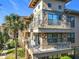 Building exterior with stone accents and multiple balconies at 904 Charo Pkwy # 525, Davenport, FL 33897