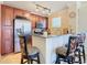 Modern kitchen with stainless steel appliances and granite countertops at 904 Charo Pkwy # 525, Davenport, FL 33897