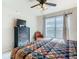 Spacious main bedroom with king-size bed, dresser, and large window at 904 Charo Pkwy # 525, Davenport, FL 33897