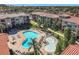 Resort-style pool with lounge chairs and a kiddie pool at 904 Charo Pkwy # 525, Davenport, FL 33897