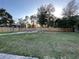 Large backyard with grassy area and fire pit at 12128 Sw 41St Pl, Ocala, FL 34481