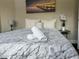 Cozy bedroom with plush bedding and wall art at 12128 Sw 41St Pl, Ocala, FL 34481