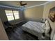 Bedroom with a bed, chair, and large window at 12128 Sw 41St Pl, Ocala, FL 34481