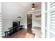 Comfortable bonus room with hardwood floors and TV at 12128 Sw 41St Pl, Ocala, FL 34481