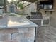 Outdoor kitchen with granite countertop and grill at 12128 Sw 41St Pl, Ocala, FL 34481